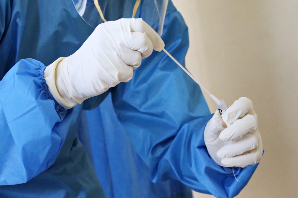 Nurse preparing PCR test